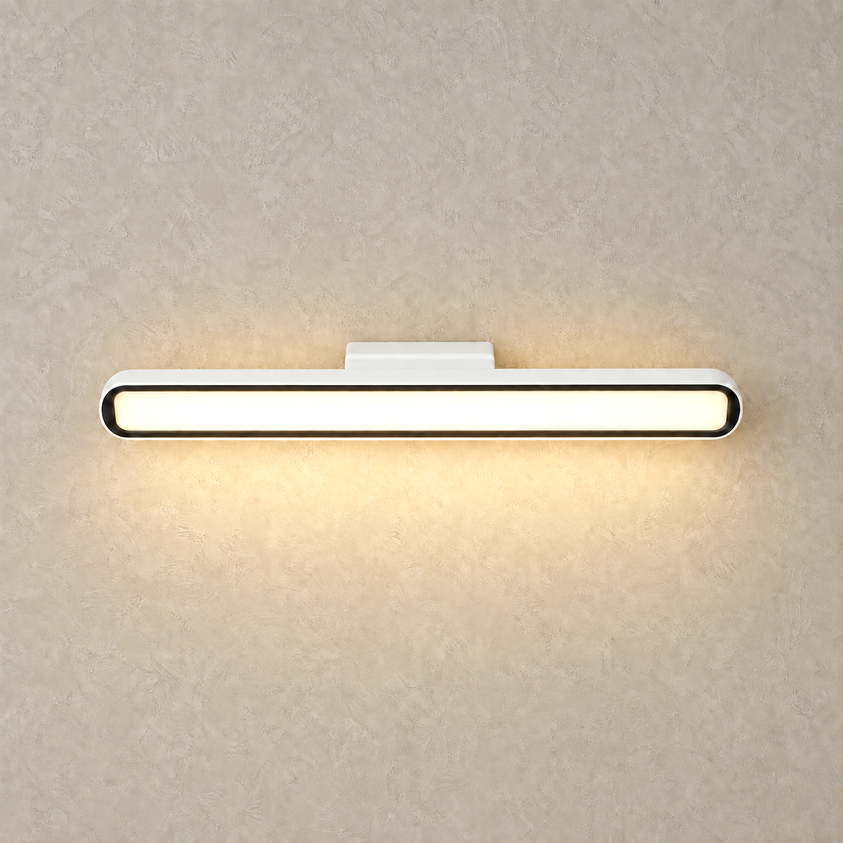 Tirelan white LED wall sconce glowing softly against greige plaster on a studio plate