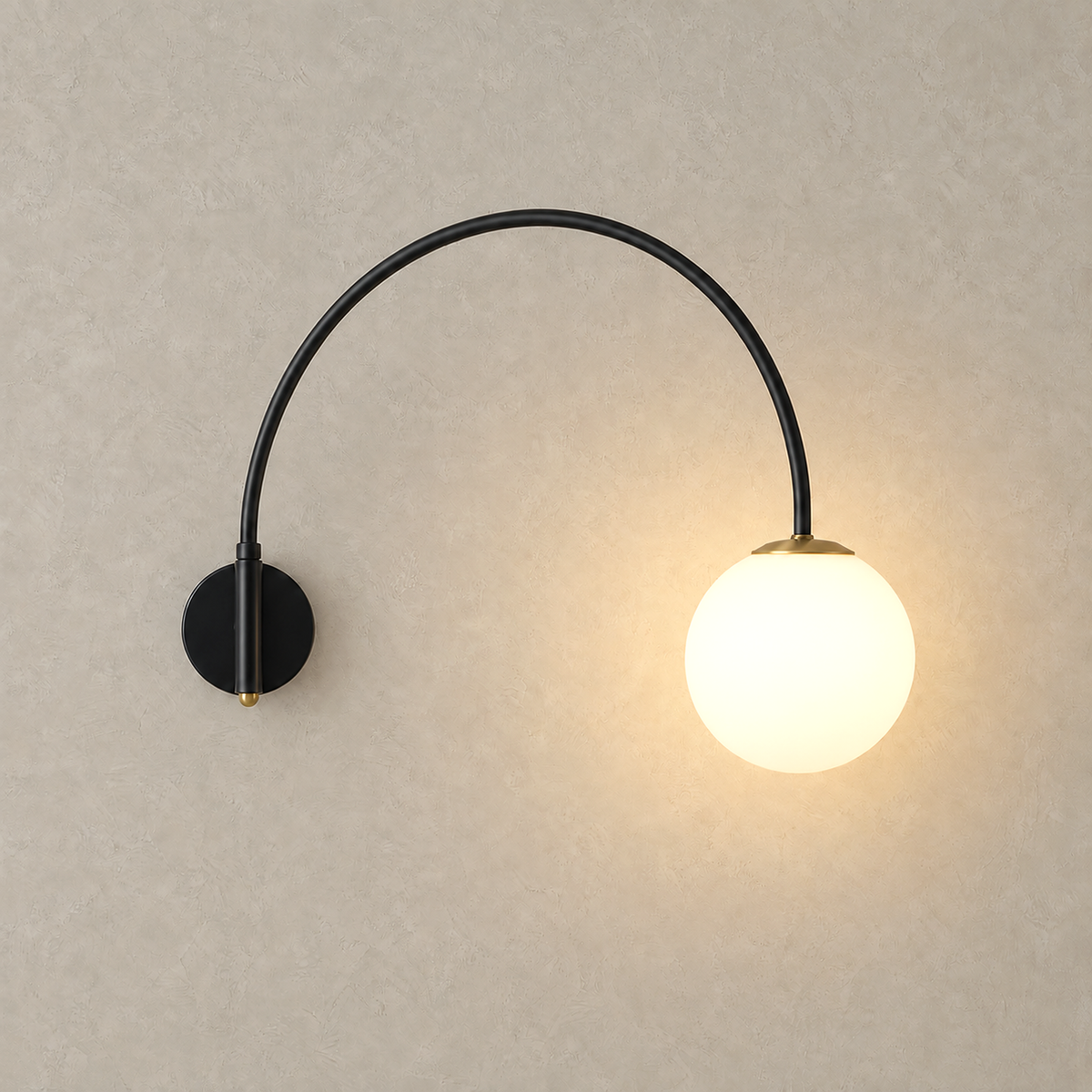 Tirsalo black and white wall sconce with a glowing frosted glass globe on an arched arm