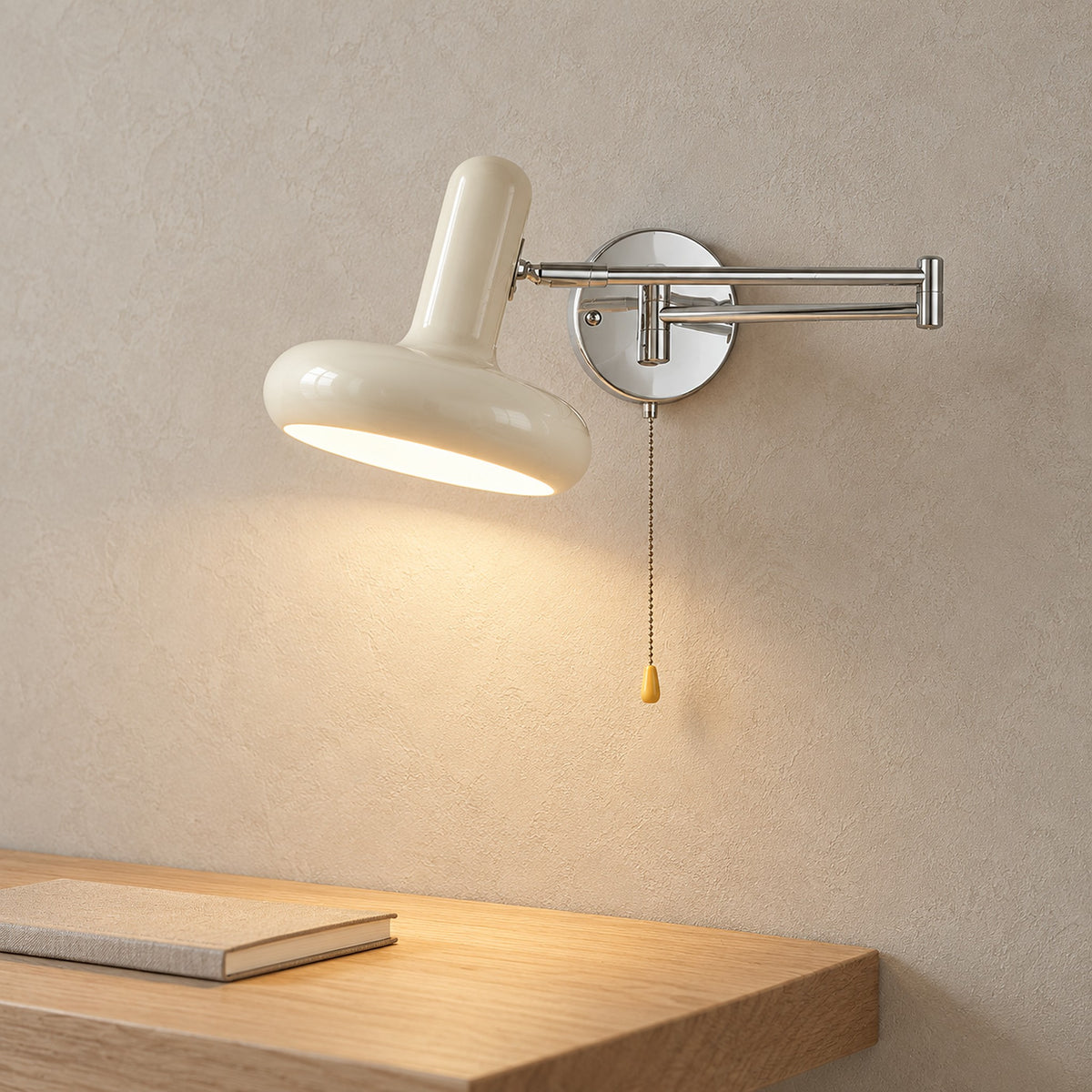 Tivenola cream hardwired wall sconce, round reflective silver backplate seated against plaster