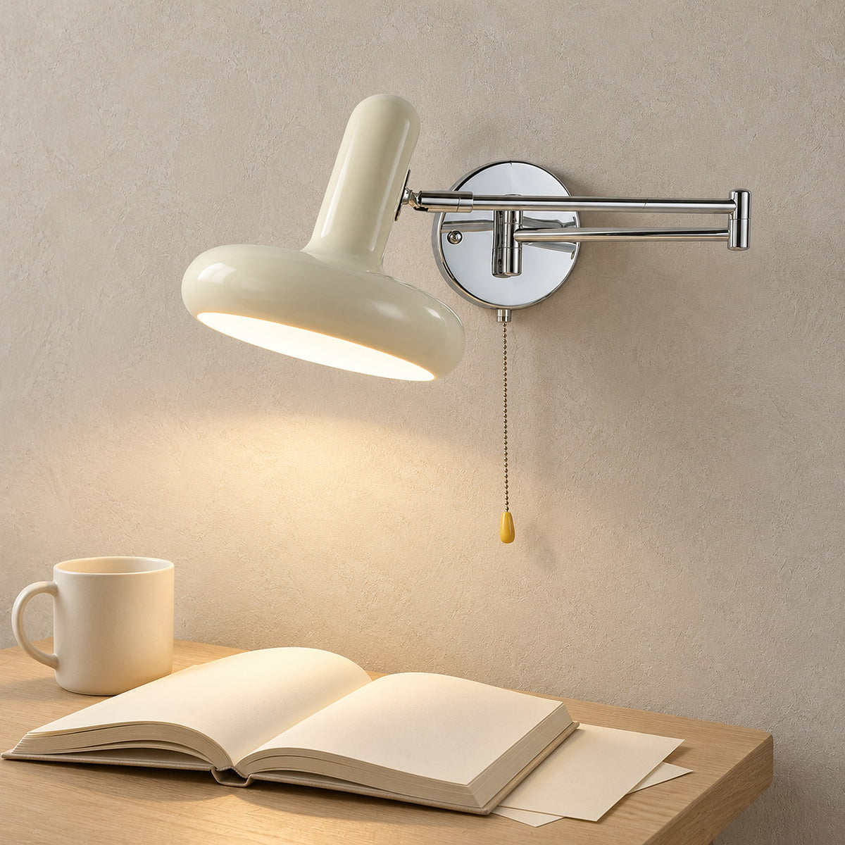 Tivenola cream wall lamp lighting a row of books above a clear desk in a living room writing nook