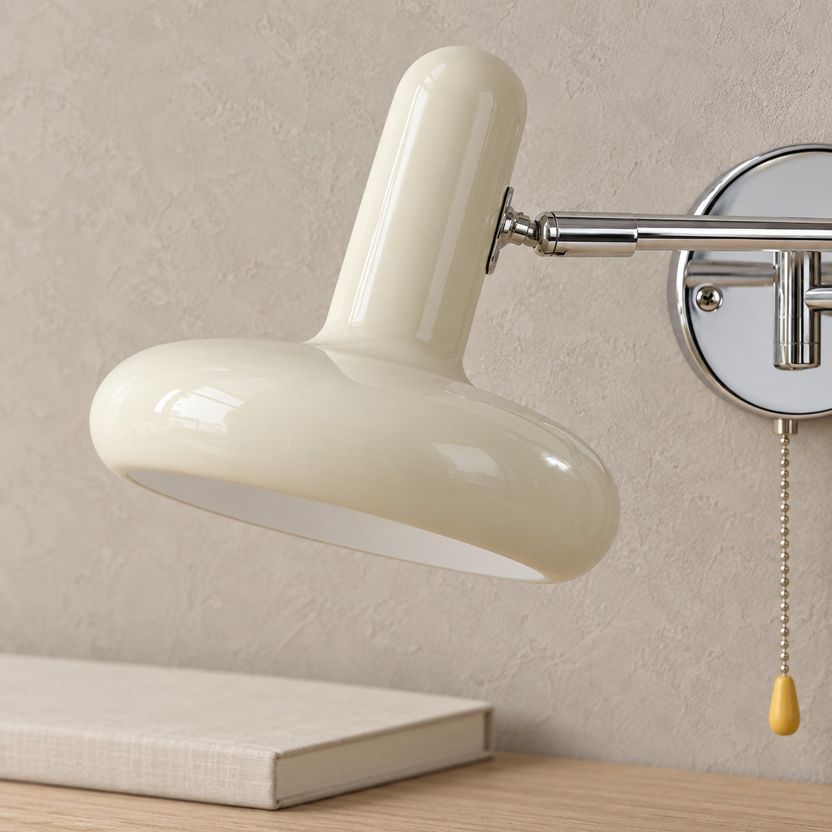 Tivenola cream wall light, close detail of the baked paint iron shade and extendable arm