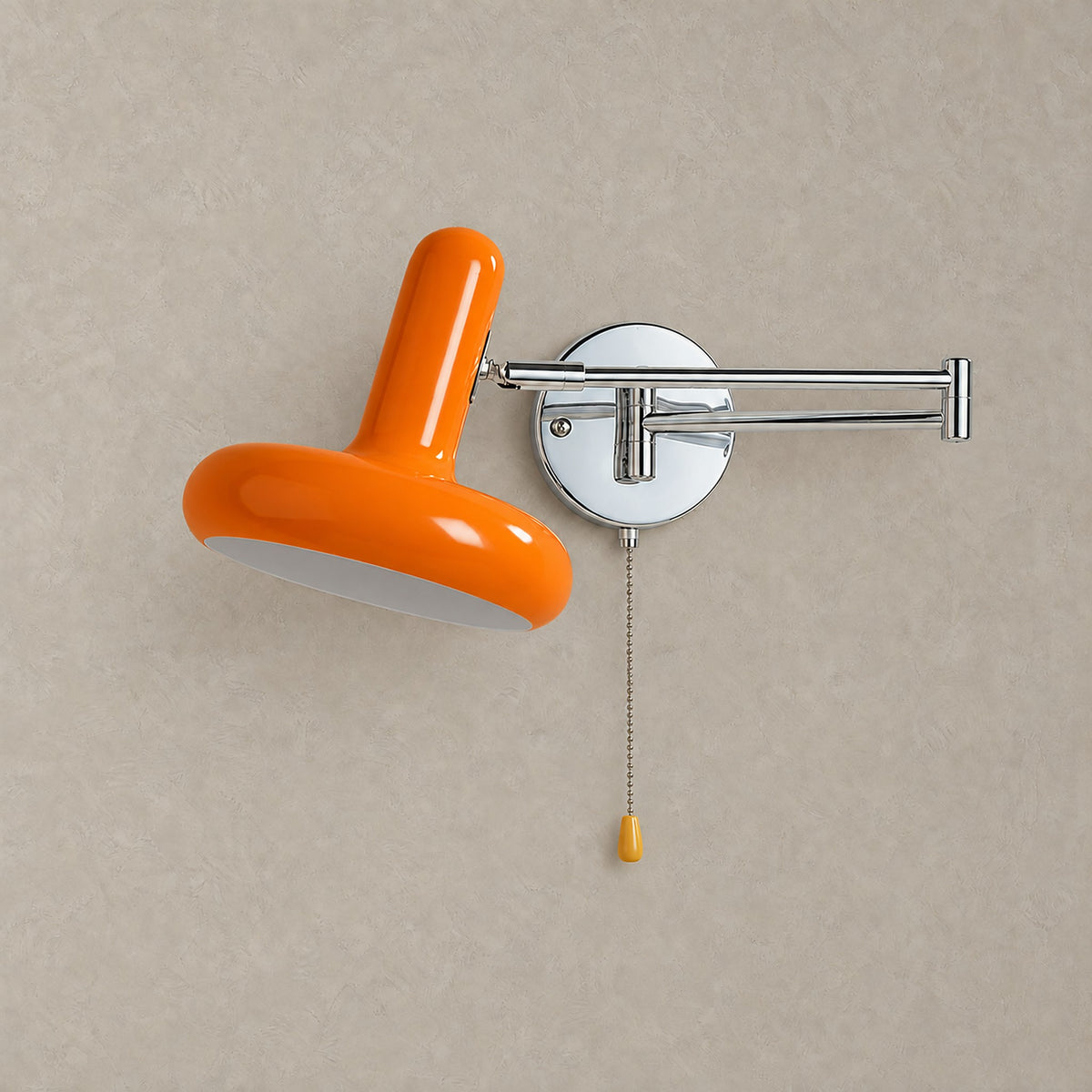 Tivenola orange hardwired wall sconce with swing arm, unlit on plaster with a silver backplate #color_orange