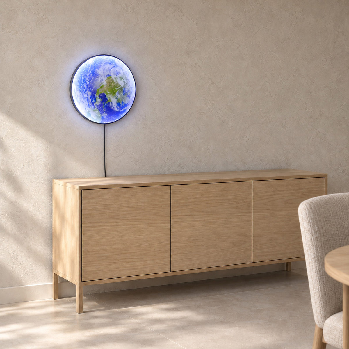 Tolanvi earth wall light in blue earth and dark rim, a plug in wall light seen at an angle above a sideboard