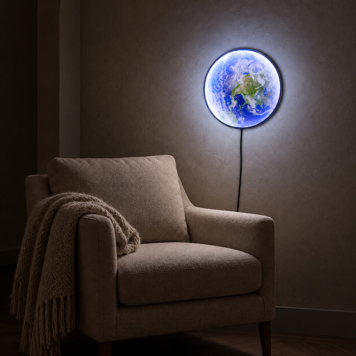 Tolanvi earth wall light in blue earth and dark rim, a wall lamp lighting the plaster beside a chair at night