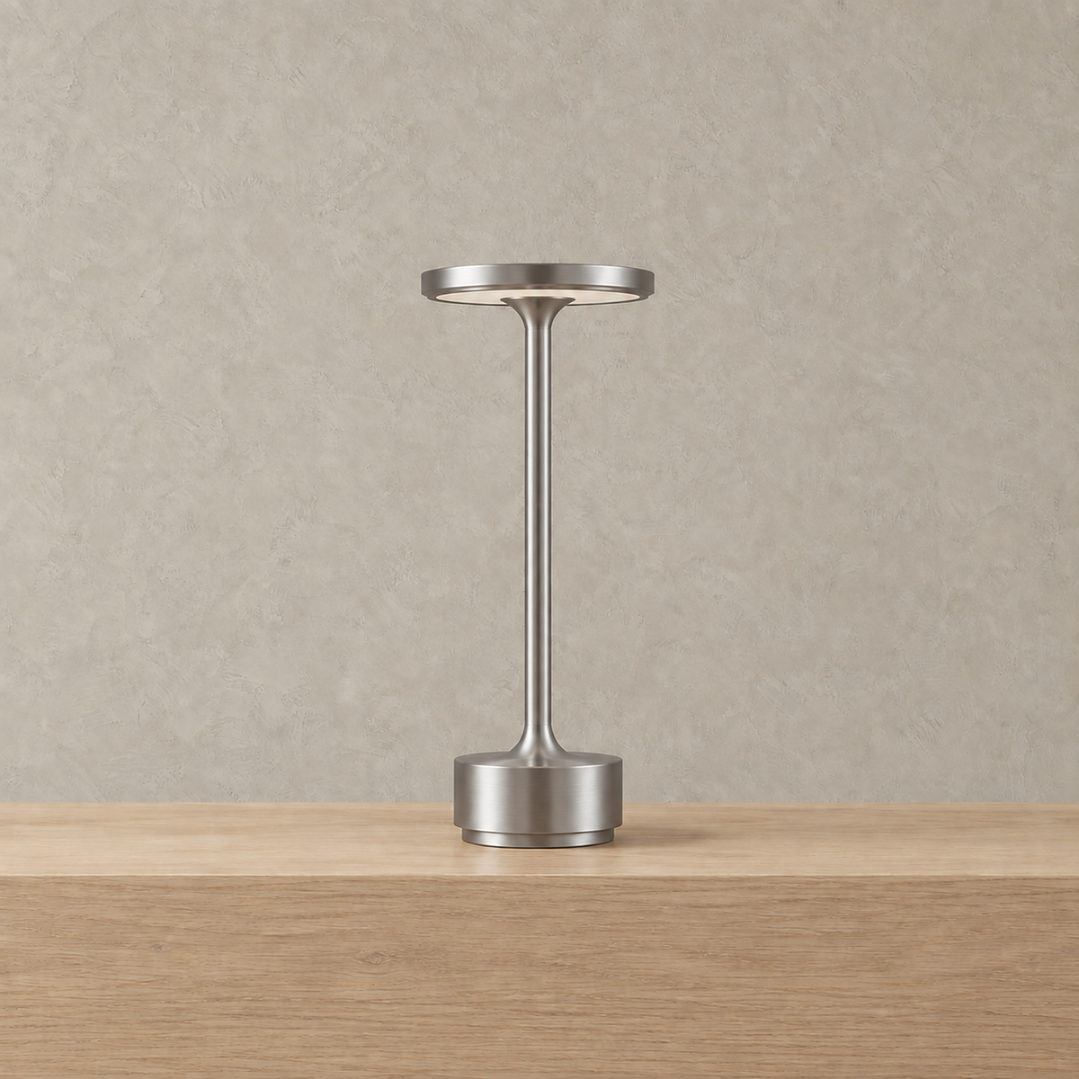 Tolimera bedside lamp in silver standing alone with its light switched off #color_silver