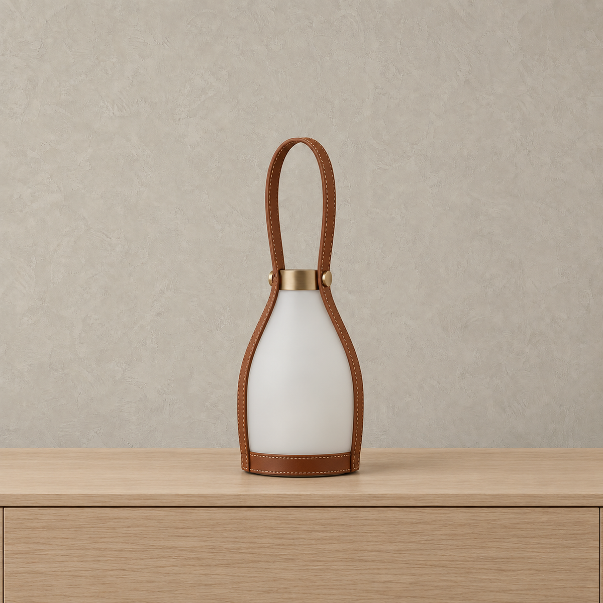 Tolvesa main rechargeable table lamp shown unlit with frosted glass shade and brown strap handle