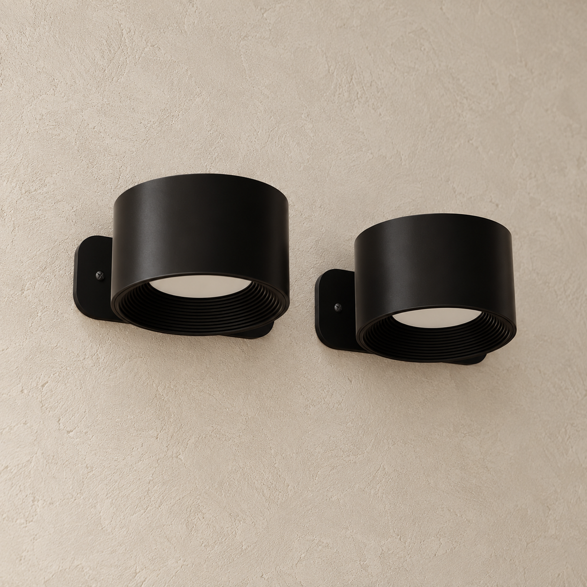 Tomelira black battery operated wall sconce detail showing recessed faces and concentric inner ridges