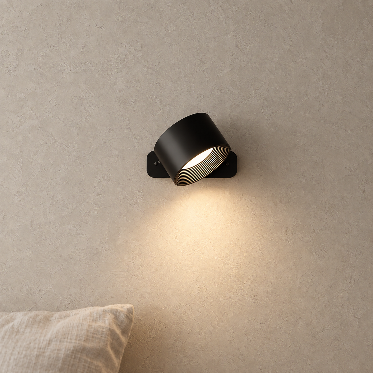 Tomelira black battery operated wall sconce pair with adjustable heads aiming light down beside a bed