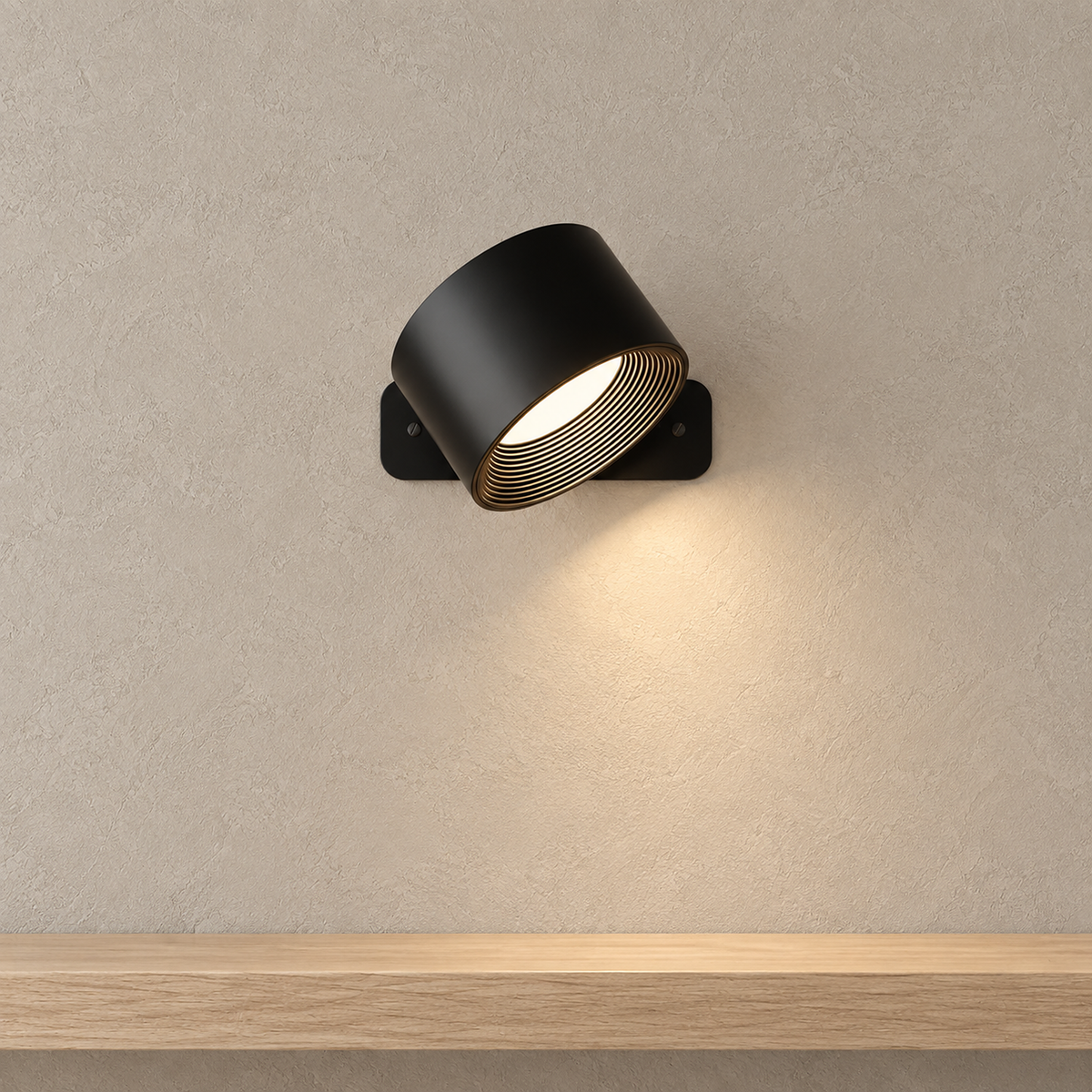 Tomelira black LED wall sconce with one tilted head casting a warm directional wash above a shelf