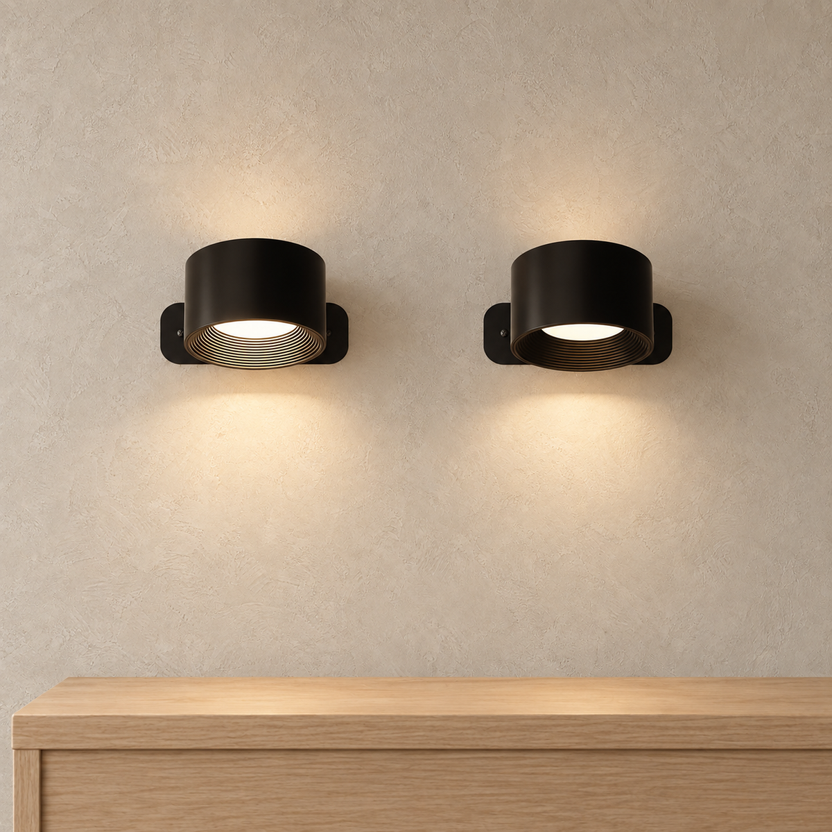Tomelira black rechargeable wall sconce pair glowing above an empty entryway console