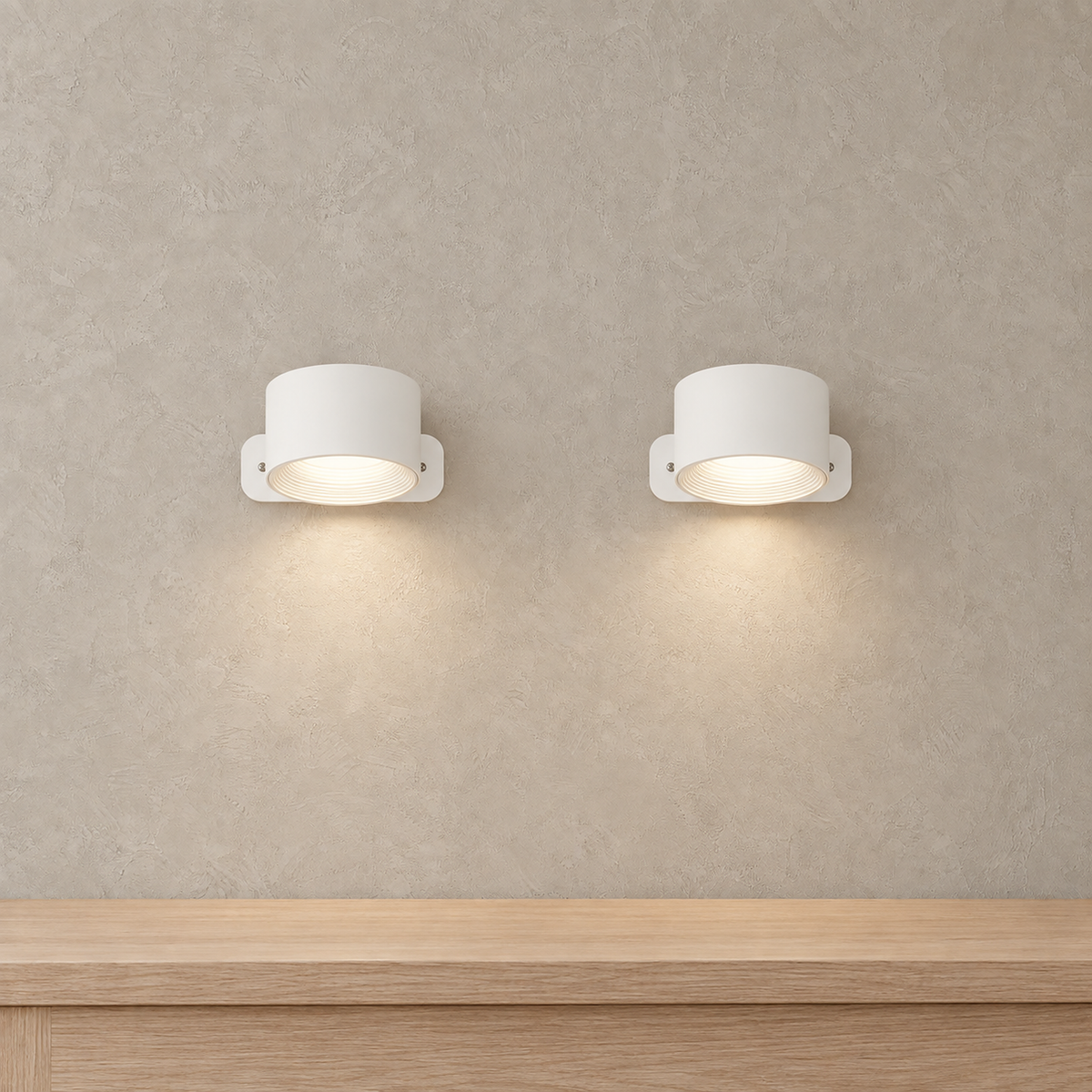 Tomelira white LED wall sconce pair illuminated in daylight above a reading corner console #color_white
