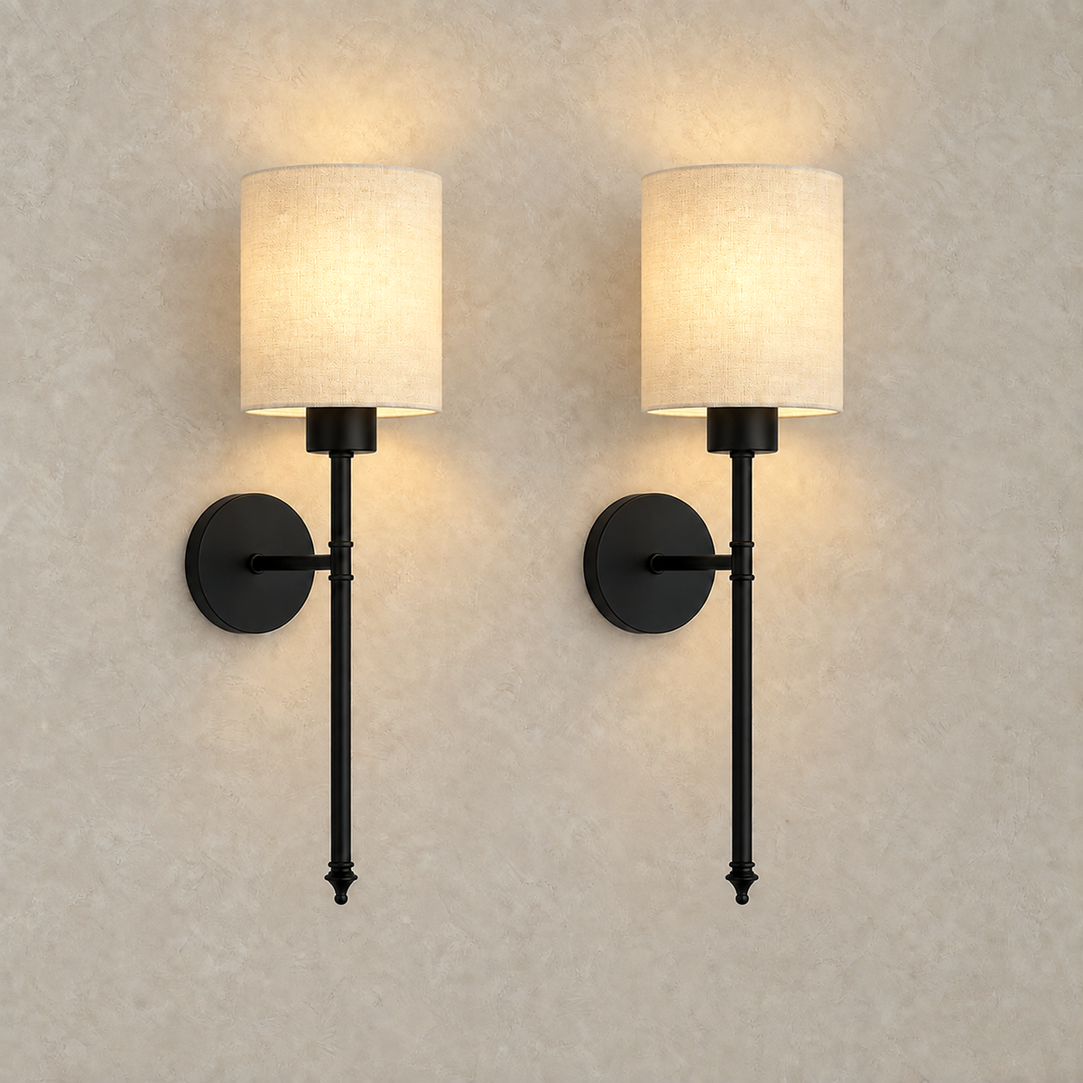 Toselio black wireless wall light pair glowing on a plaster wall