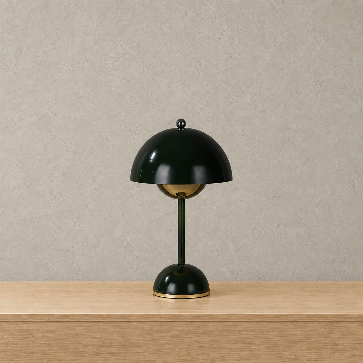 Varimel black rechargeable table lamp standing unlit with its glossy rounded domed base