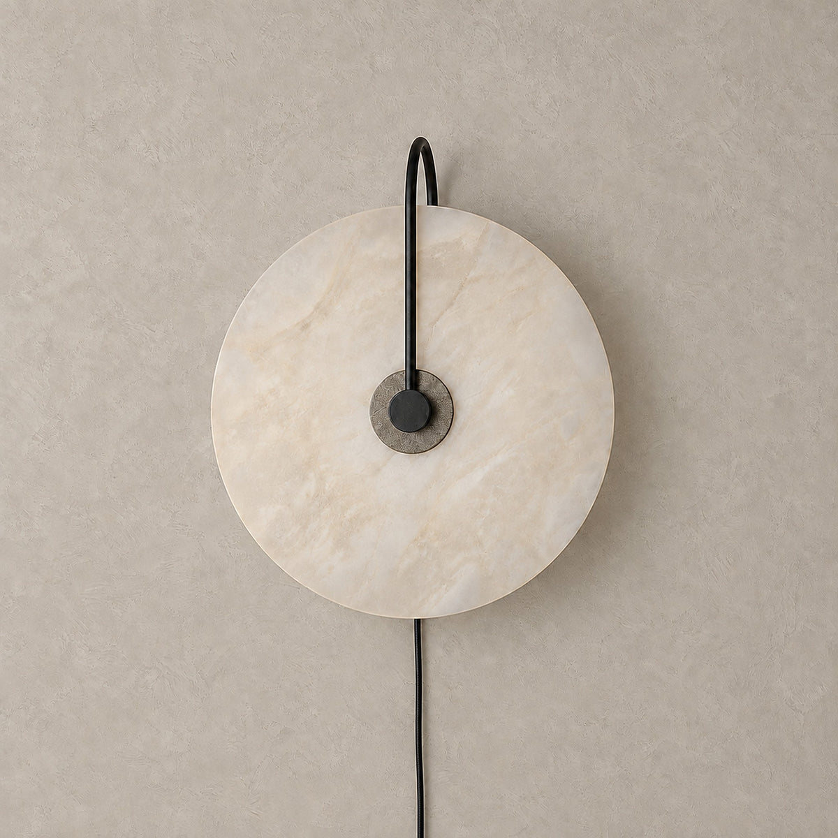 Velirsa black led wall sconce with a pale shade, unlit against warm greige plaster
