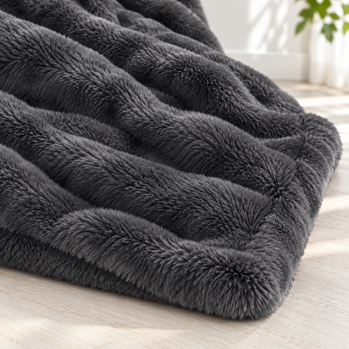 Vemorila dark gray plush throw blanket in close view, showing the dense faux rabbit fur pile