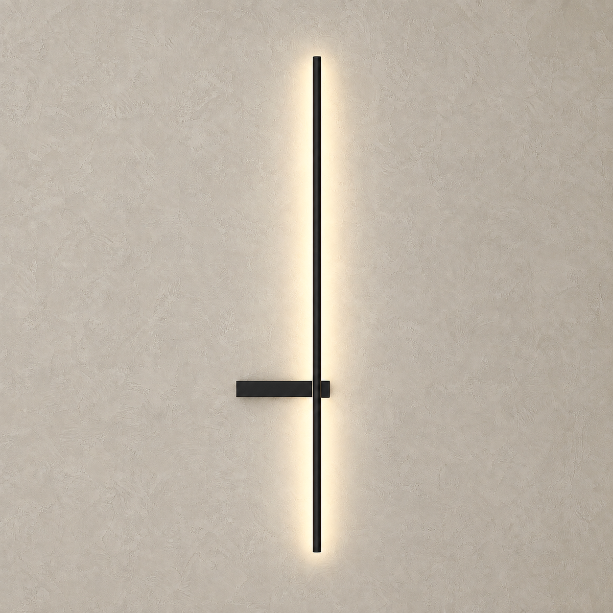 Vesarilo black LED wall sconce casting warm light across greige plaster